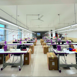 Inside view of the sewing workshop at YISWIM, featuring mordern sewing machines and a spacious production area for swimwear manufacturing.
